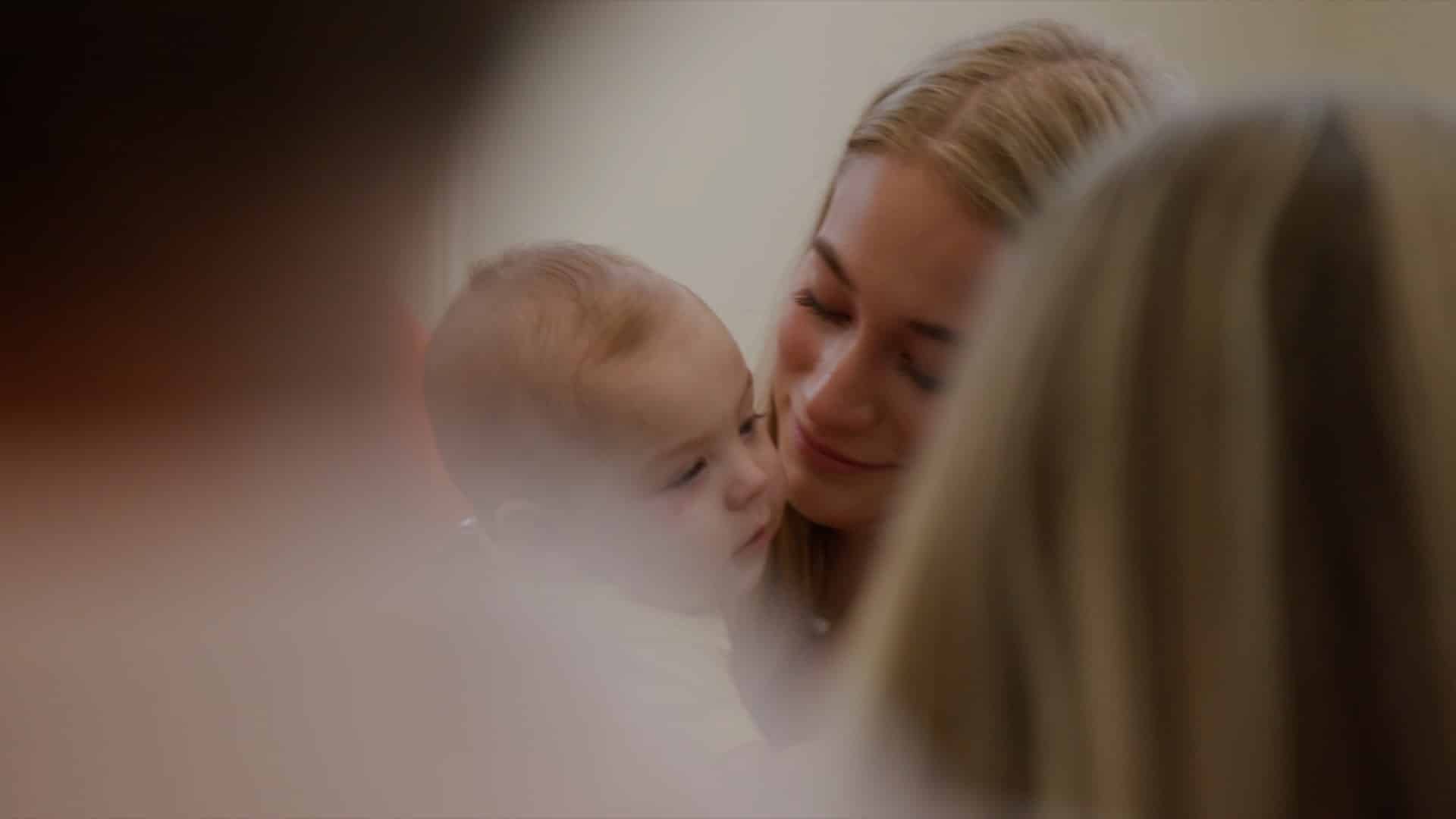 girl holding baby